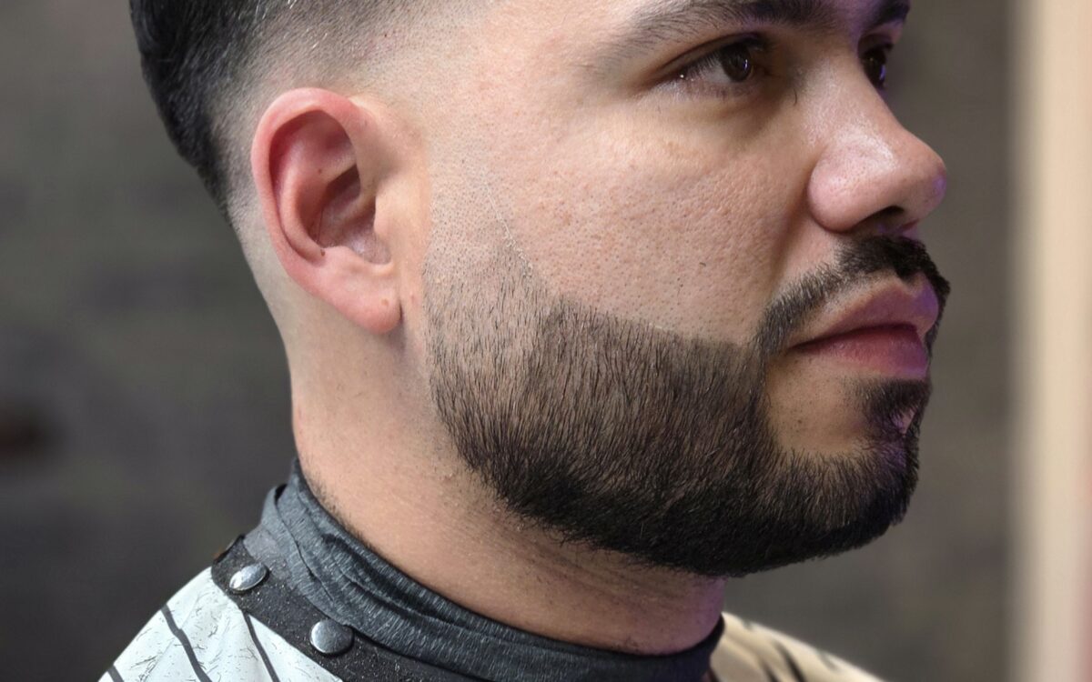 Man sitting in a chair after having a mobile barber haircut